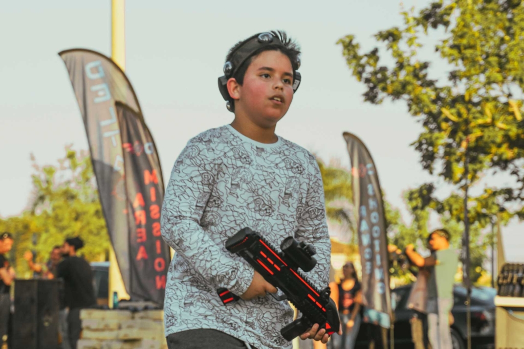 Young boy playing laser tag in Jávea Spain