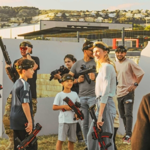 Kids and adults preparing to play laser tag